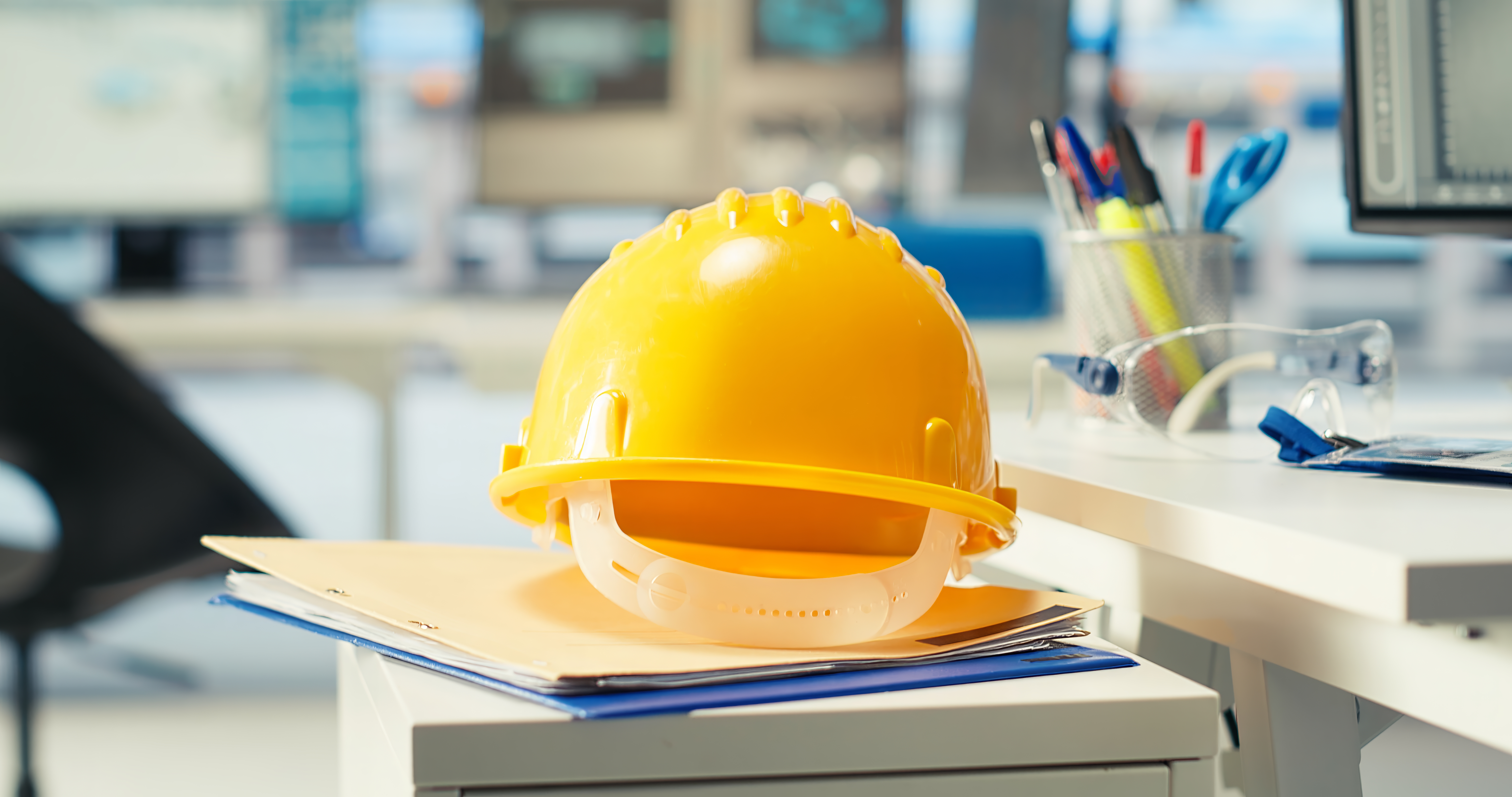 Close Up Yellow Hardhat Empty Solar Plant Facility